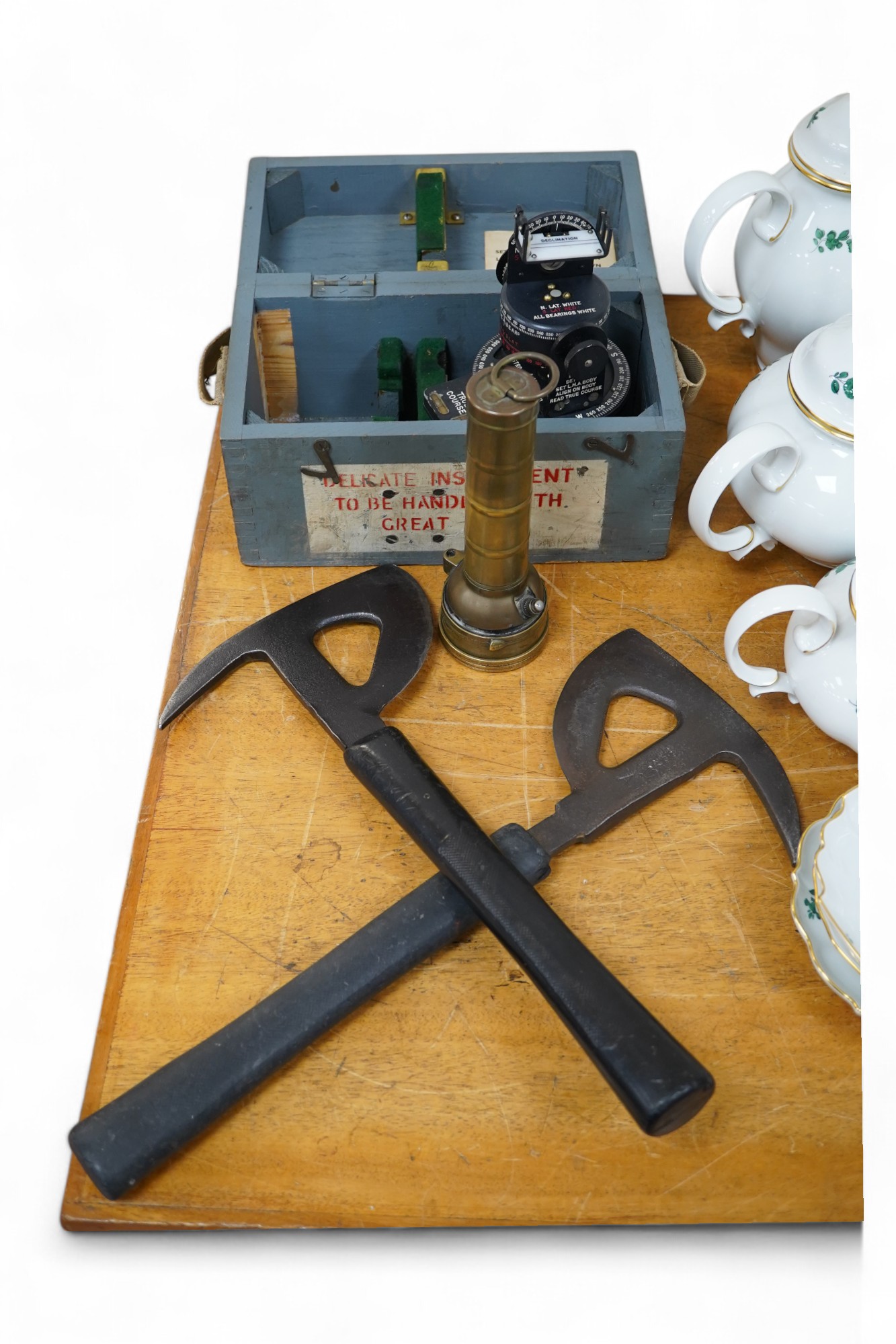 Two WWII RAF Air Ministry aircraft escape axes, one stamped; Elwell 1943, a cased Astro Compass Mk.II, and a brass Air Ministry signalling torch. Condition - fair to good.